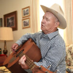 Sandy Pinkard plays the guitar
